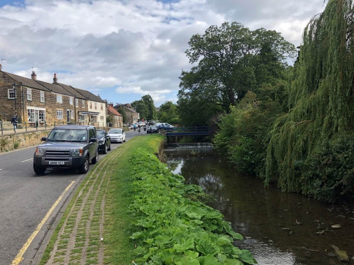 A car parked on the side of a road
Description automatically generated